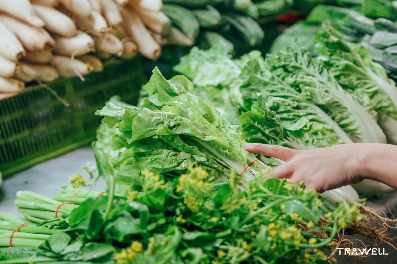 Woman's hand selecting fresh vegetables